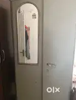 Steel almirah with a mirror in left door