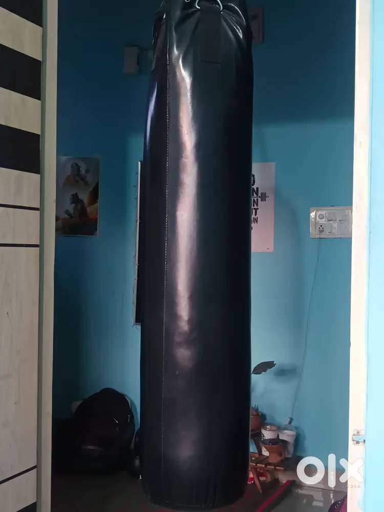 I have a wooden folding table and a bin bag and a boxing bag
