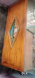 Counter with attached glass shelf