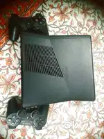 Xbox 360 slim case with ps3 dualshock controllers.