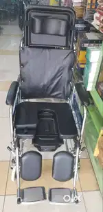 Reclining wheel chair with commode
