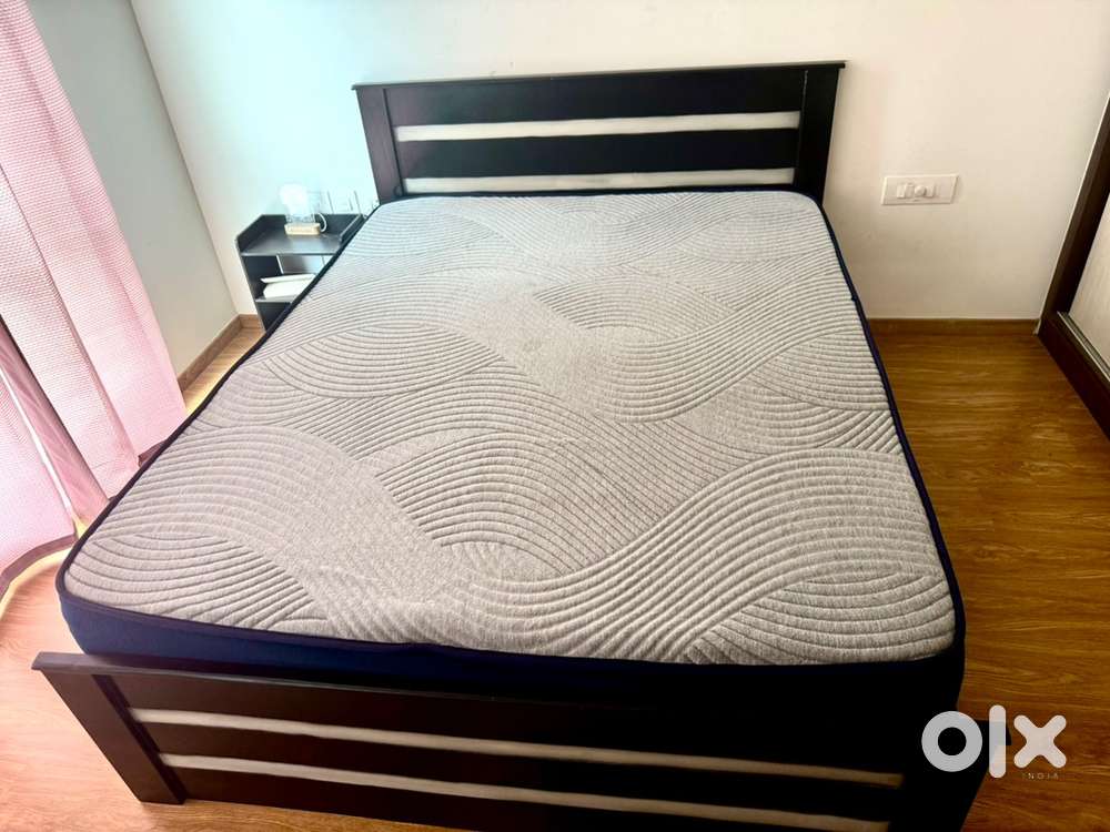 Queen sized bed with Mattress and sidetable