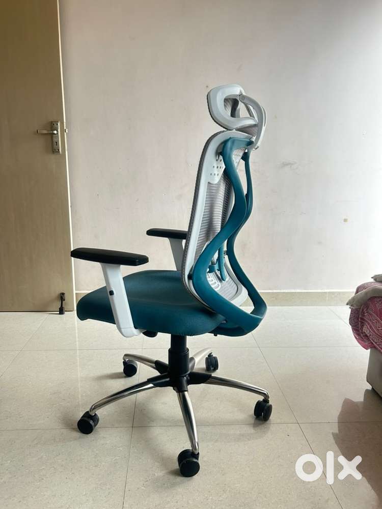 Revolving ergonomic chair with lumbar support
