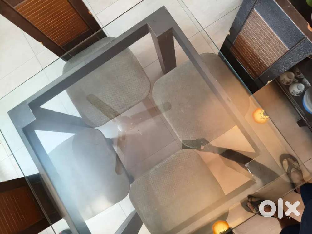 4,4 glass dining table with 4 chairs