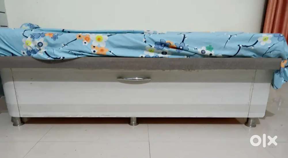 Single wooden bed with mattress Rs 12000; T-poy/center table Rs.5000
