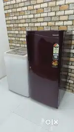 Maroon colour single door fridge and top load fully automatic machine