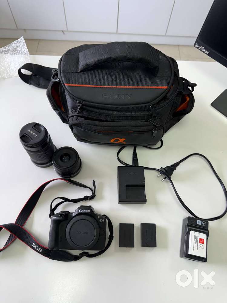 Canon R100 Mirrorless Camera and 18-45mm and 55-210mm Canon Lens