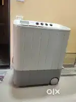 Samsung Semi-Automatic Washing Machine and Wooden Table in Working