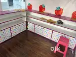 shop display counter with storage cabinets,