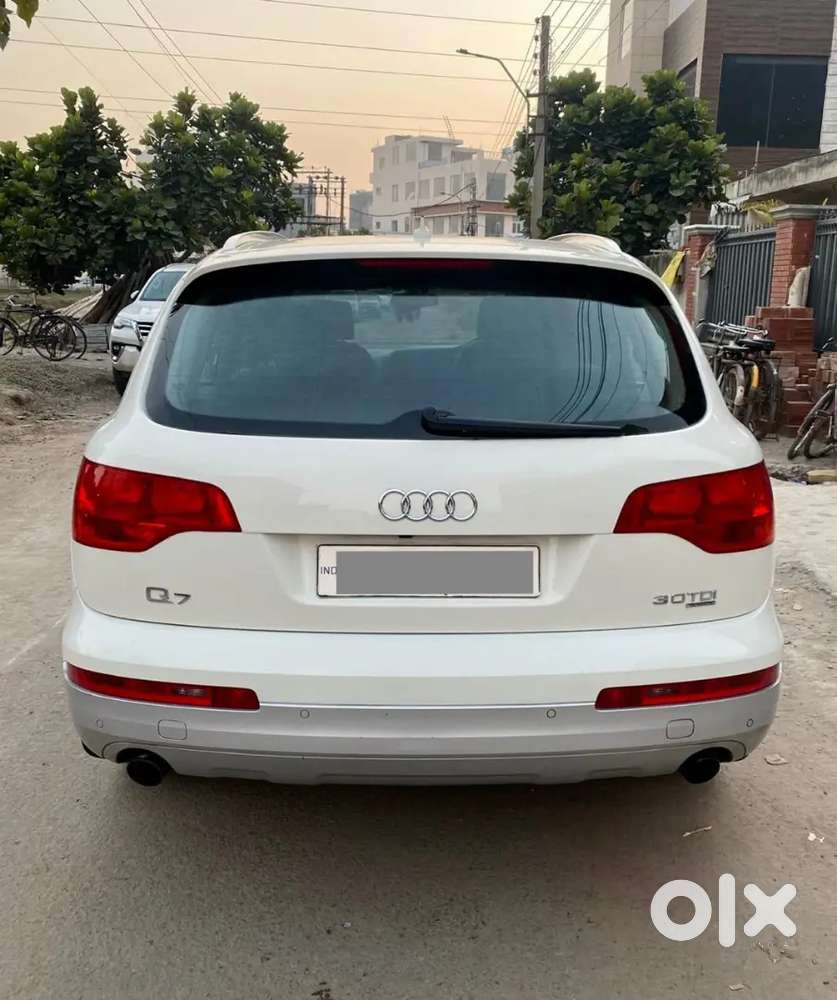 White with beige interiors. Sunroof with moon roof.