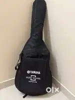 Yamaha black acoustic guitar