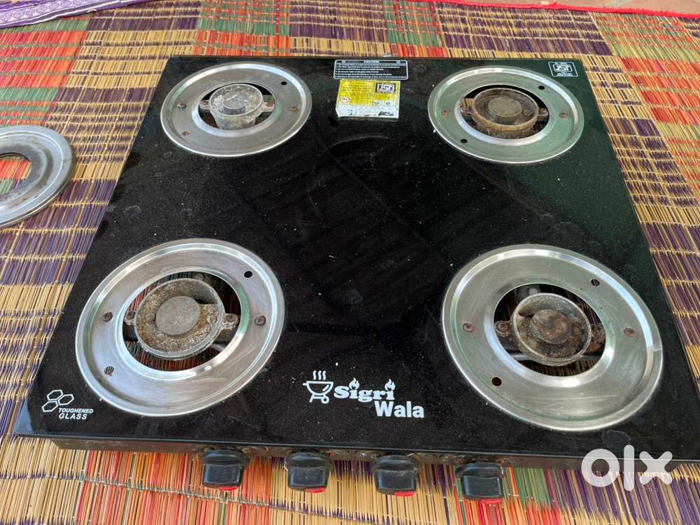 Glass top gas stove with burner