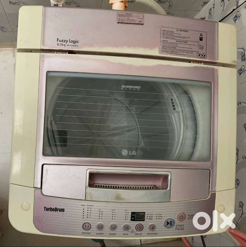 LG Automatic 6 kg Washer Dryer (Lotus Pink) washing machine with cover
