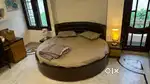 Round bed with mattress and side table