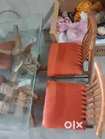 Glass dinning table with four wood chair