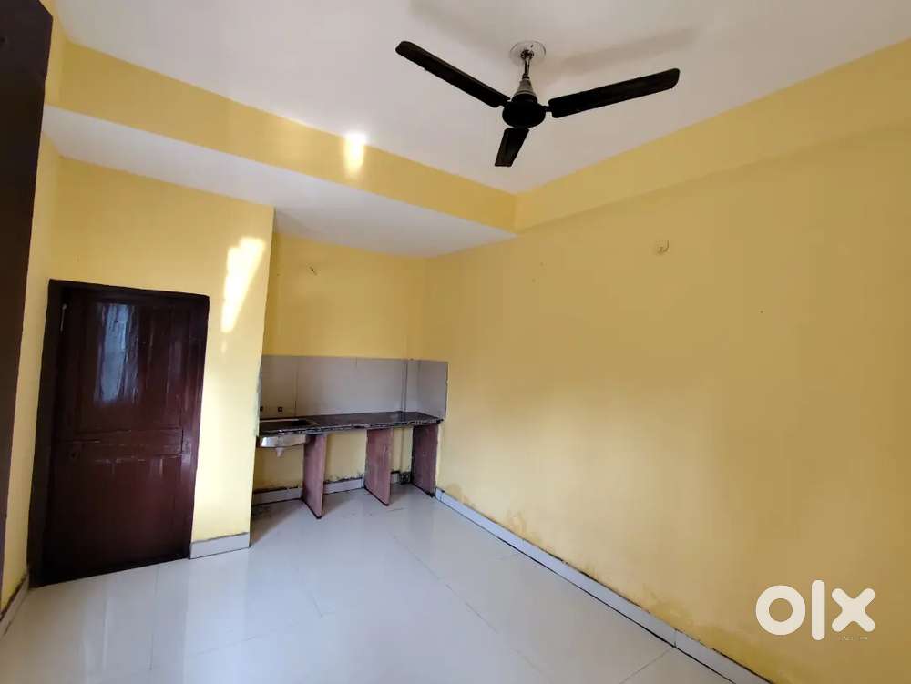 One single room with attached kitchen platform and bathroom