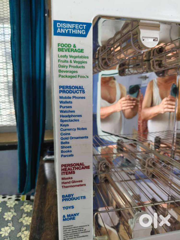 Sanitizer cabinet with ultra-violet lights for germs/virus free goods