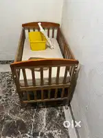 Baby cot with bedding