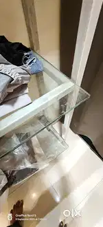 Metal garments shelf with glass