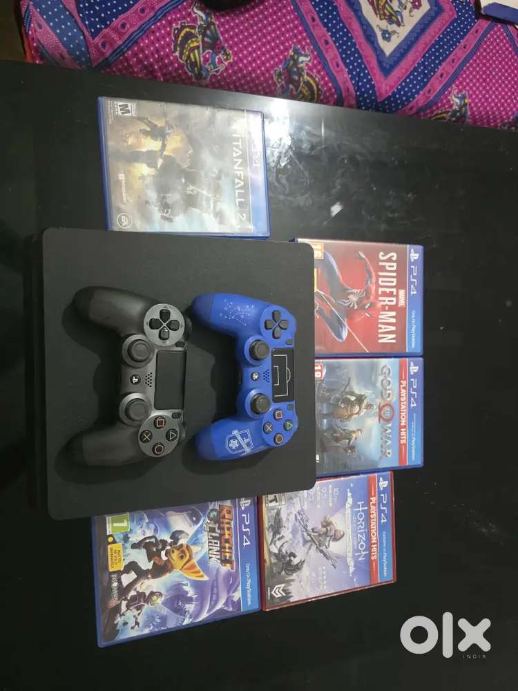 Ps4 slim 1tb 5 cd 2 controller