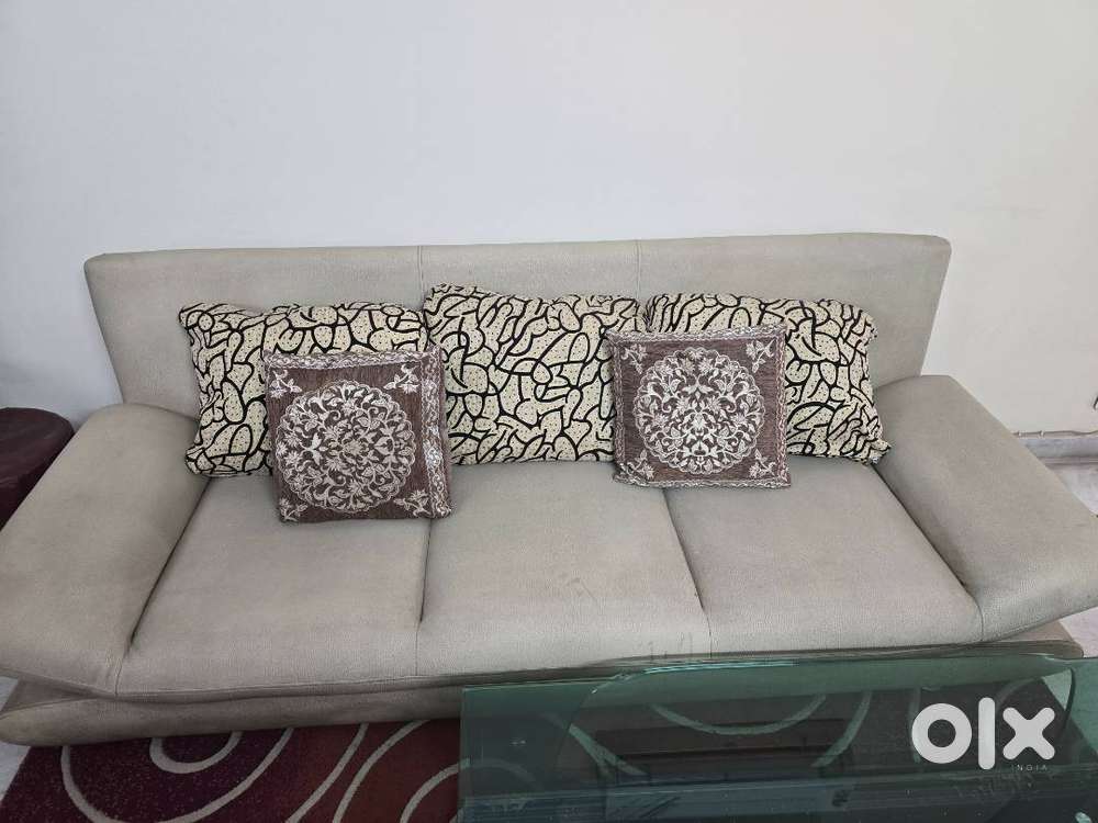 6 seater sofa and glass center table