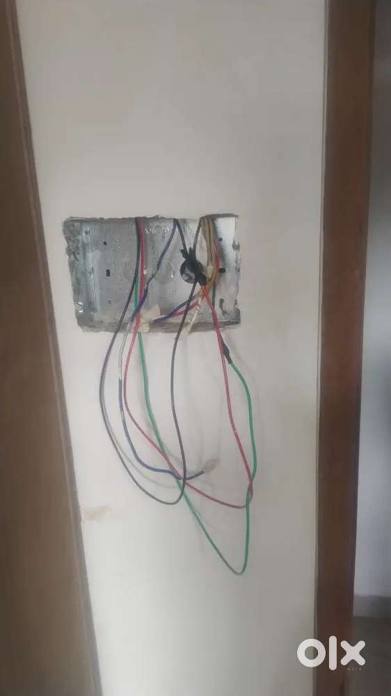 Electrician working all  light fitting and box switch Cheng wearing