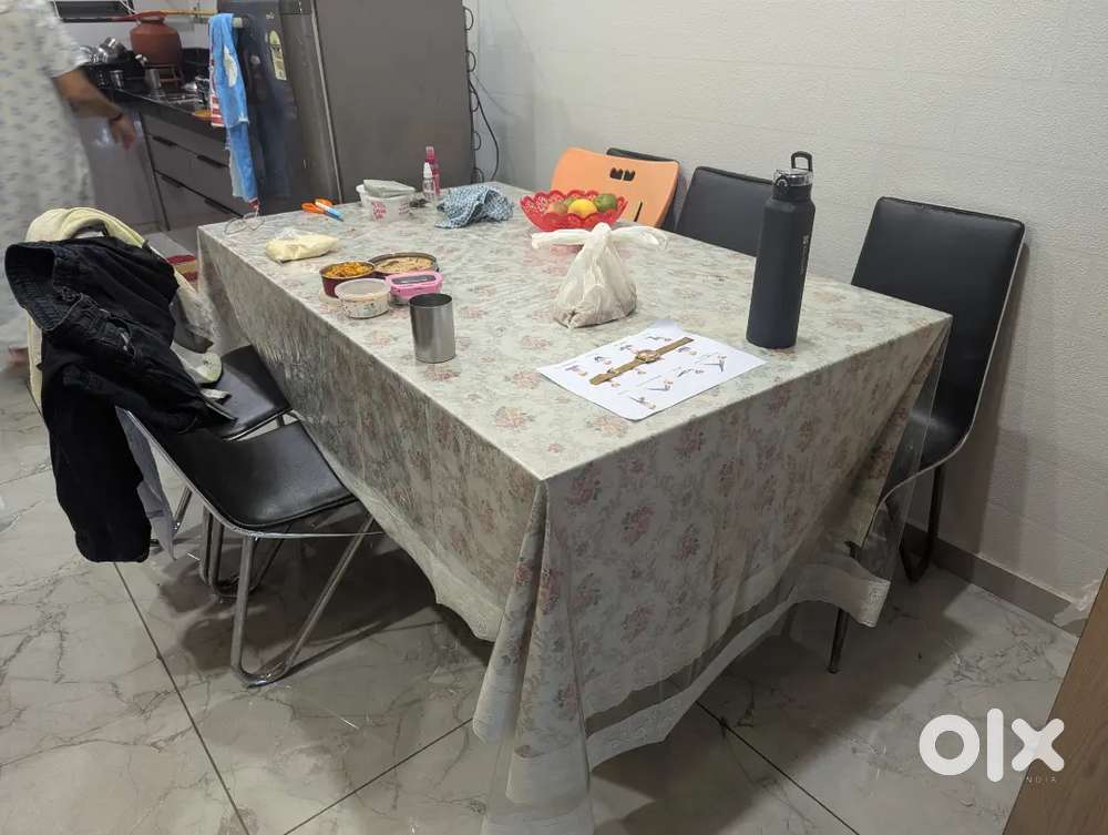 Dining table with six steel and leather chairs