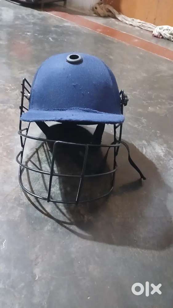 Cricket kit containing helmet gloves pads