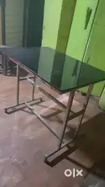 Glass Tables and Honeycomb shaped red plastic chairs