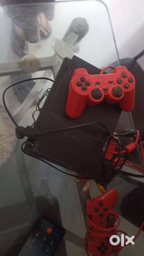 Play station 2 with two remotes fesh and orignal