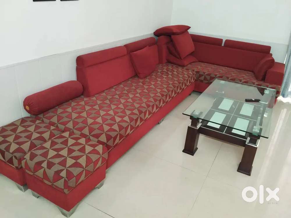 Sofa with cover, central glass table
