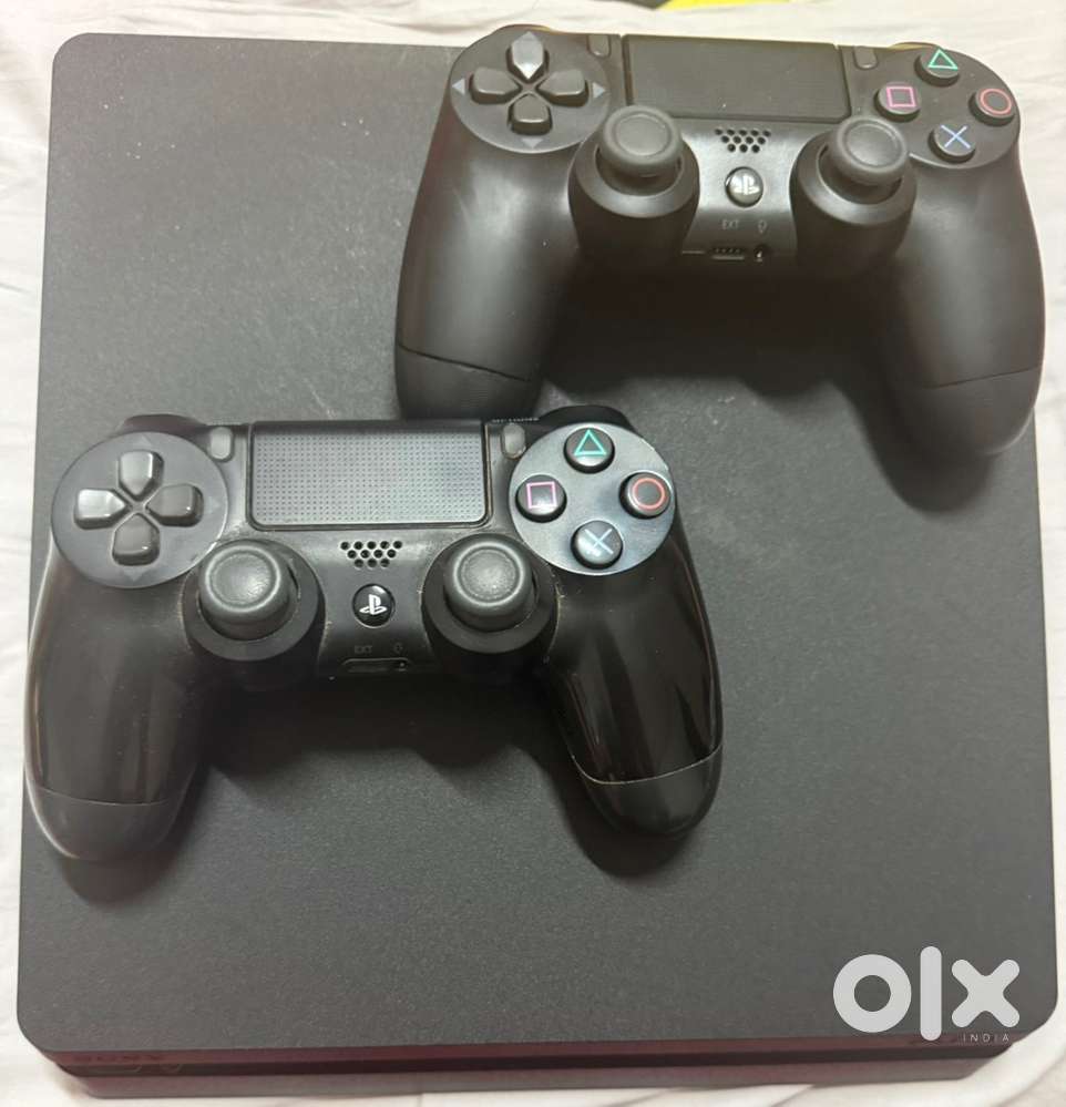 Sony PS4 slim 1tb Excellent Condition + 2 orignal dualshock Controller