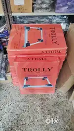 Washing machine adjustable trolley
