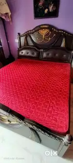 Wooden bed , along with mattress