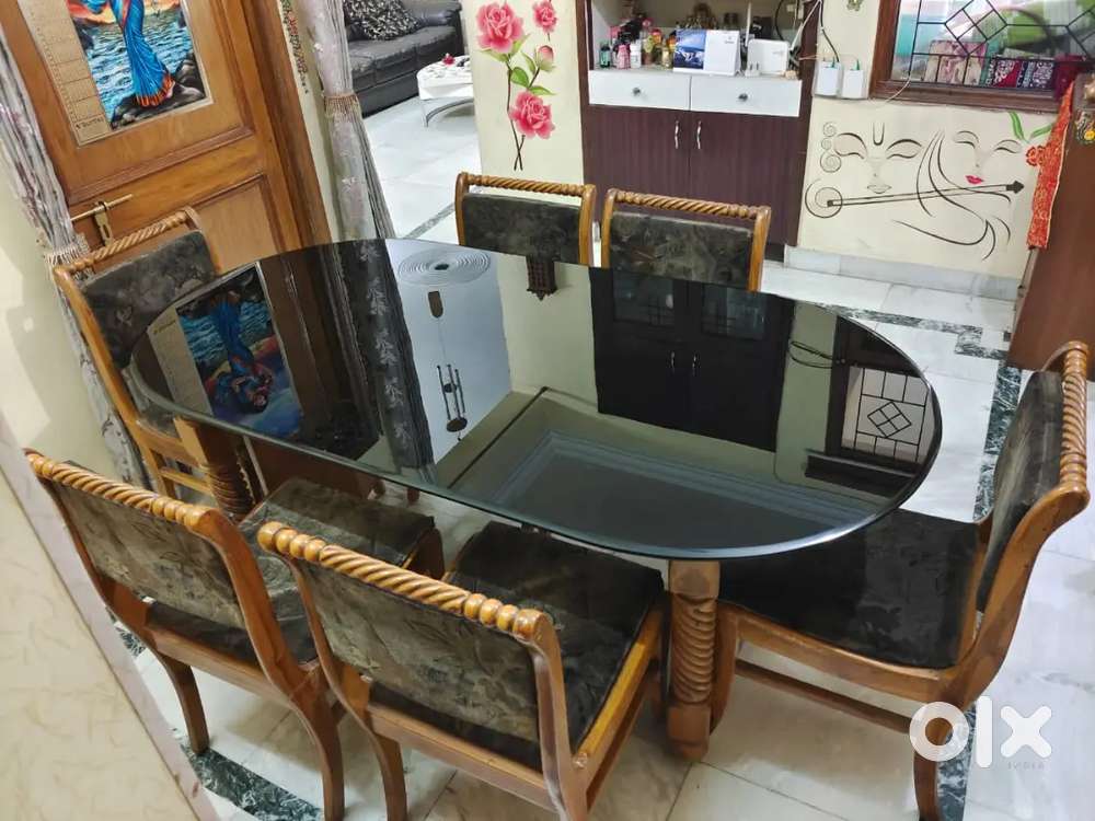 Pure teakwood 6 seater dining table with black glass top