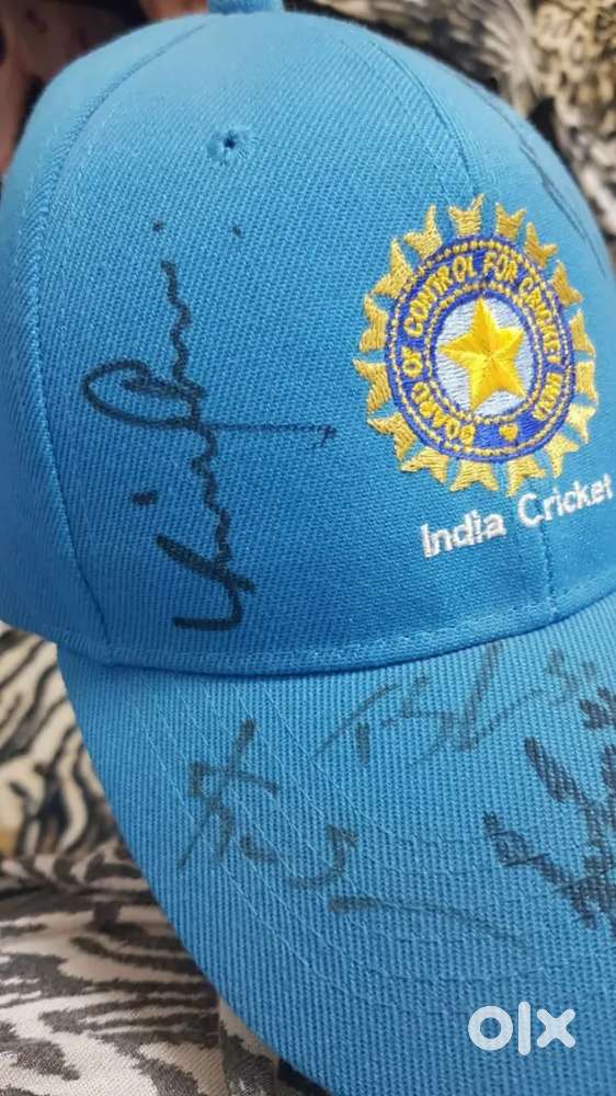 Virat kohli and other Indian players autograph cap.