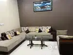 9 Seater Sofa with cushions and a center table.
