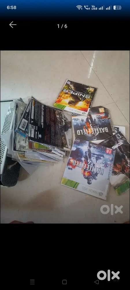 Xbox 360 with game CDs