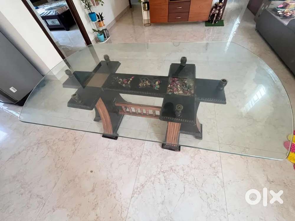 Glass top dining table with six chairs