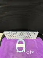 Apple Magic Keyboard with its USB-C to Lightning cable. Key