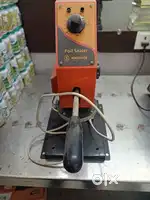 a manual hand-operated foil sealer used for sealing