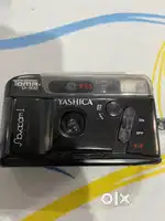 One Yashika camera & one Mikona camera flash in very good condition