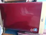 Whirlpool washing machine maroon colour.