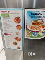 Godrej Microwave 23 litre with starter kit and booklet.
