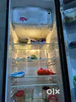 Samsung fridge for sale along with 2 chairs And table