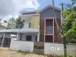 AN ELEGANT NEW 4BED ROOM 1850SQ FT 5.75CENT HOUSE IN OLLUR,THRISSUR