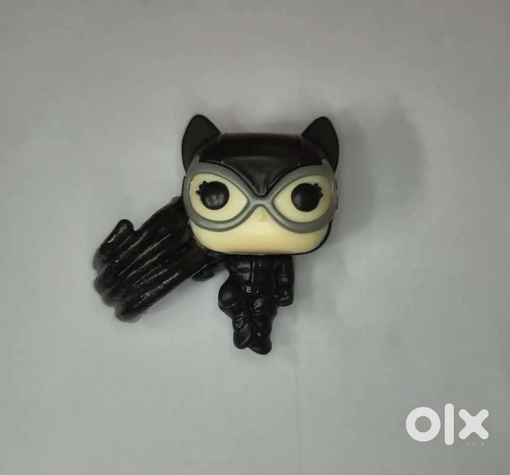 This is a Kinder Joy! figure of Catwoman from the DC universe.