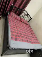 Queen size Iron Cot with ample space for storage