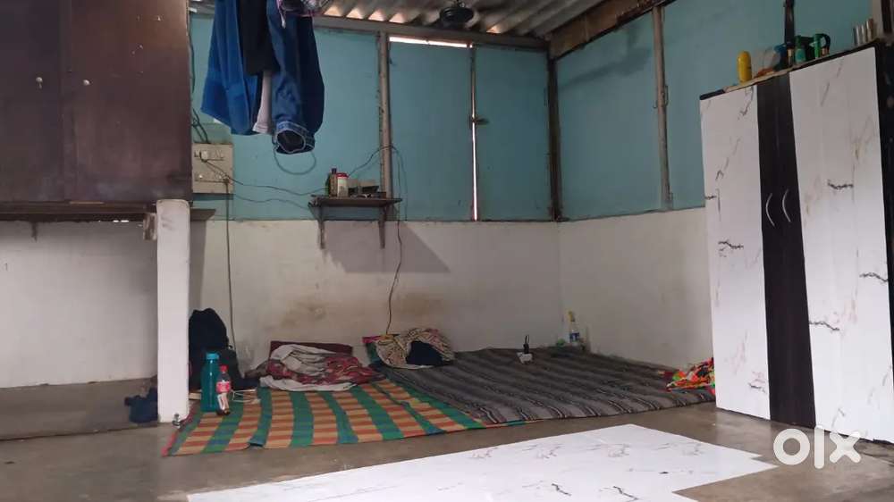 Single chawl with kitchen and bathroom.