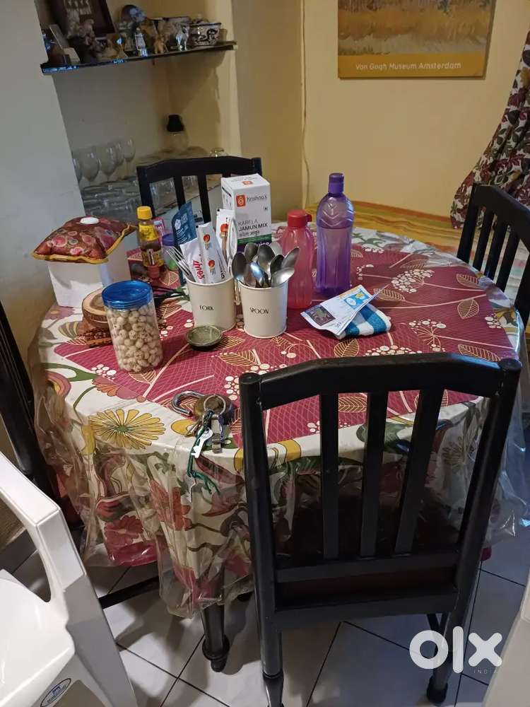 4 seater sofa and round dining table with chairs